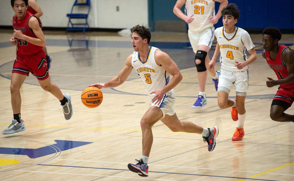 Ripon Christian’s Trey Fasani moves the ball up the court during the Sac-Joaquin Section Division V semifinal game with Vacaville Christian at Ripon Christian High School in Ripon, Calif., Wednesday, Feb. 22, 2023.