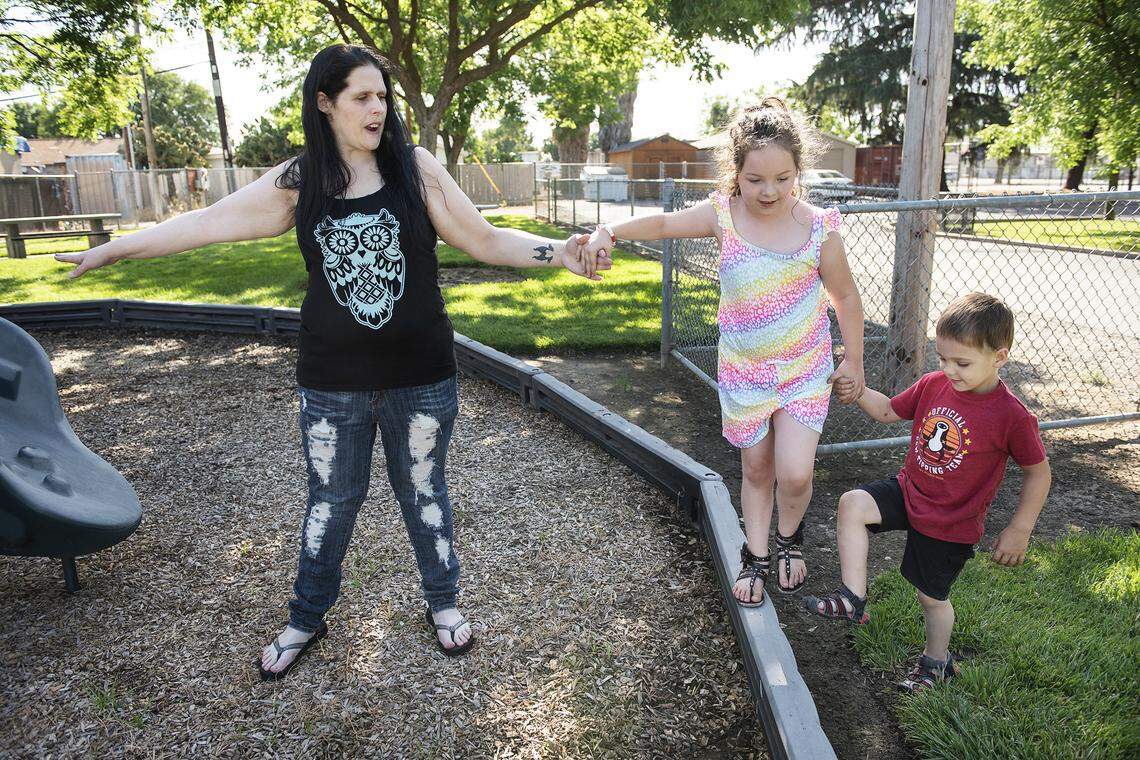 Jenn S plays with her children Danica, 6, and William, 4, at a park in Empire, Calif., on Saturday, May 9, 2020.