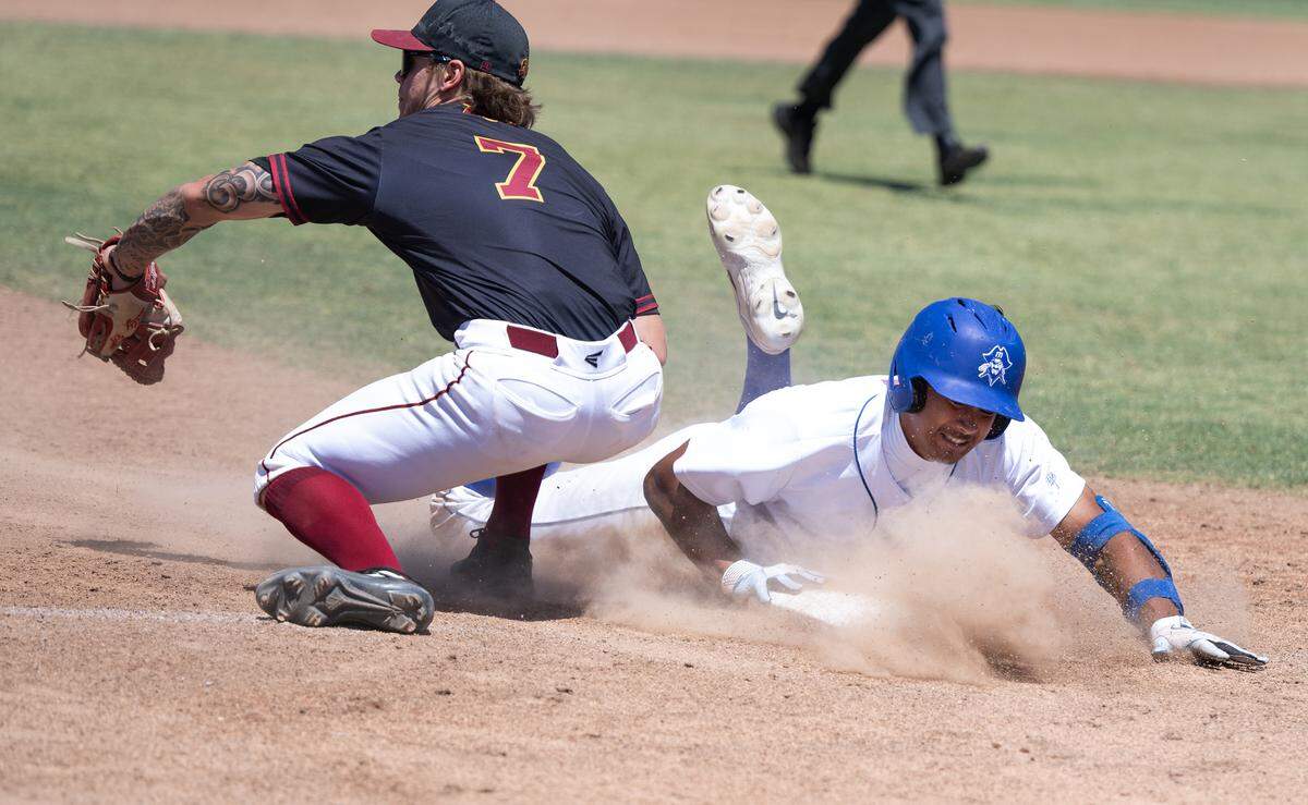 Modesto’s Paul Contreras slides safely into third on a triple during the 3C2A NorCal Regional playoff game with Sacramento City College at Modesto Junior College in Modesto, Calif., Friday, May 3, 2024. Modesto won the game 6-3.