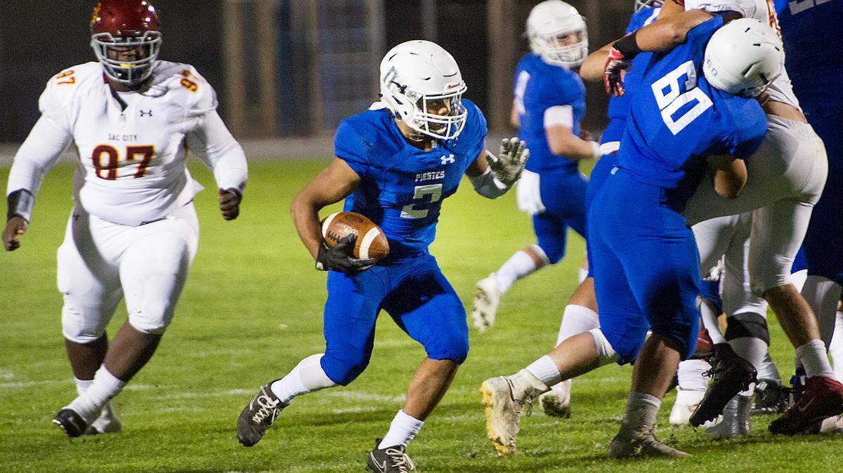 Modesto Darus Nelson runs the ball during the Big 8 Conference game with Sacramento City College at Modesto Junior College in Modesto, Calif., Saturday, Nov. 3, 2018. Modesto won the game 27-24.