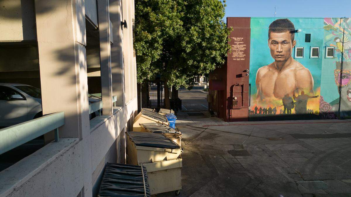 Dumpsters line the wall behind the city’s 11th Street parking garage in Modesto, Calif., Tuesday, Oct. 17, 2023.