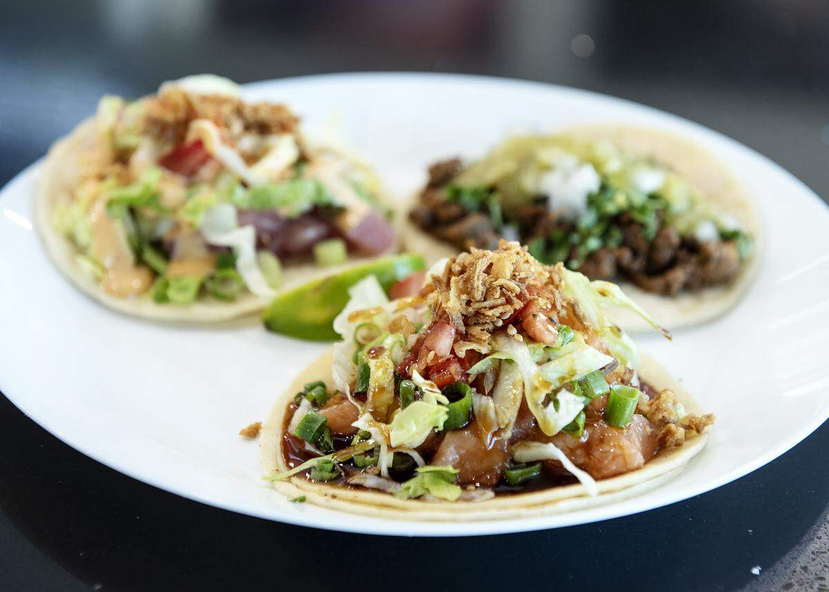 Salmon poke taco, front, with two other tacos at Terracotta Pub in Turlock, Calif., Tuesday, Sept. 24, 2019.