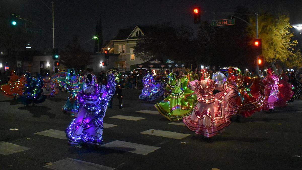 The dancers of Ballet Folklorico Los Falcones perform Saturday night, Dec. 7, 2024, in the Celebration of Lights Holiday Parade in downtown Modesto.