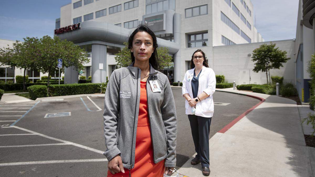 Medical director of Memorial Medical Center’s Emergency Department, Dr. Kanthi Kiran, left, and department manager Elizabeth Mendoza RN, right, stand outside the Memorial Medical Center in Modesto, Calif., on Friday, May 22, 2020.