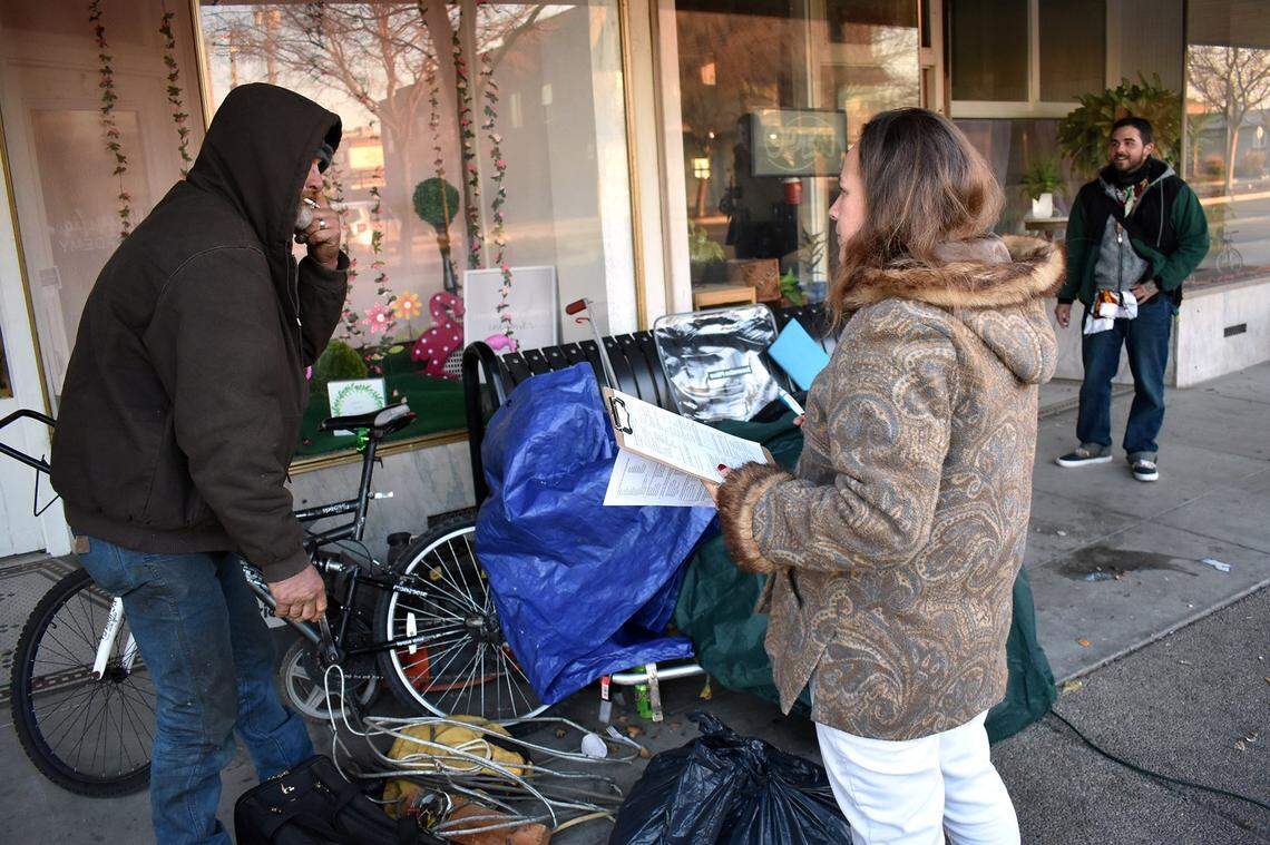 Deanna Garcia of Riverbank interviews two men, Bob (left) and Matt, during a 2019 count of homeless people. She has since become involved in a 67-unit housing project seeking funding as of February 2025.