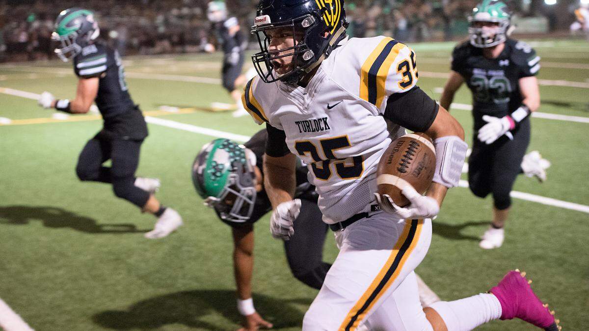 Turlock’s Cameran Sherwood runs for a touchdown after a reception during the Central California Athletic League game with Pitman at Turlock High School in Turlock, Ca., on Friday, Oct. 26, 2018. 