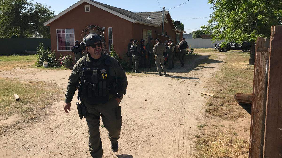 Sgt. Frank Soria of the Stanislaus County Sheriff’s Department during a warrant search of an illegal marijuana grow on Olivera Road in south Modesto on April 28. Authorities seized $55 million worth of black market cannabis in four days.