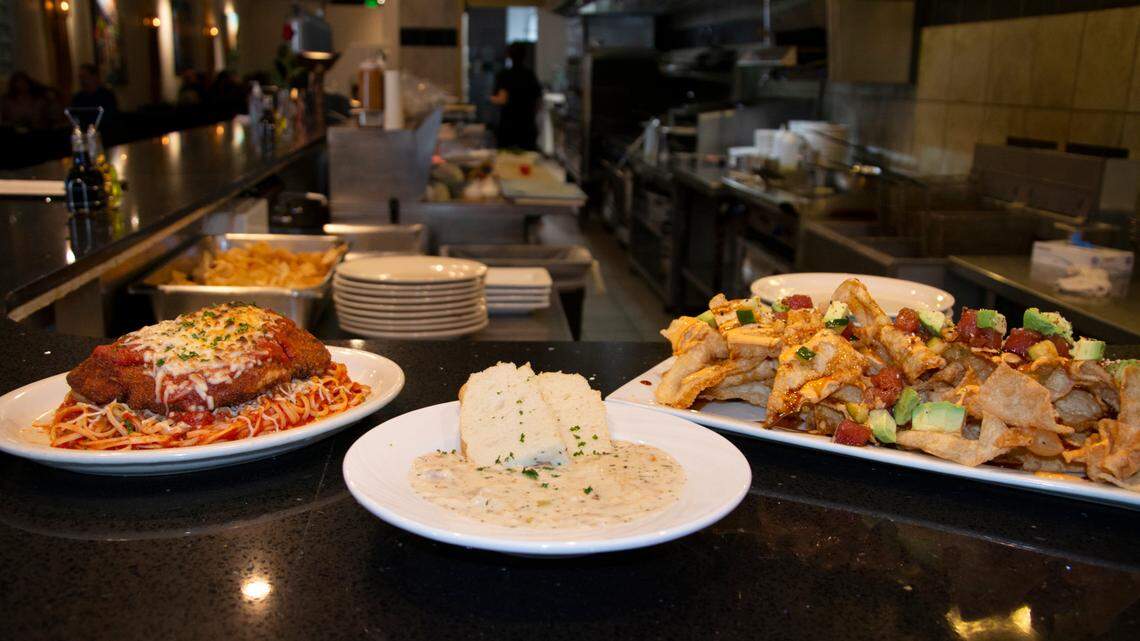 Chicken parmesan, clam chowder and poke nachos served at Midtown Bistro Jan. 15, 2021 in Modesto, Calif.