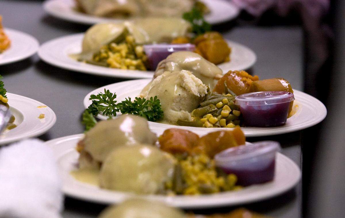 Turkey meals are set up for serving in the kitchen at a past year’s Salvation Army Thanksgiving dinner in Modesto.