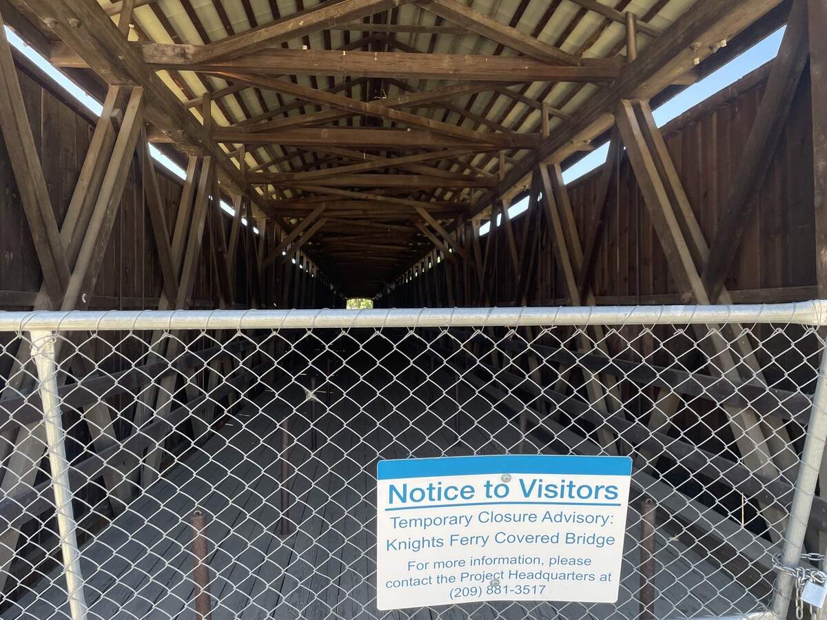 The covered bridge across the Stanislaus River in Knights Ferry is not expected to reopen for several years. Photographed June 14, 2026.