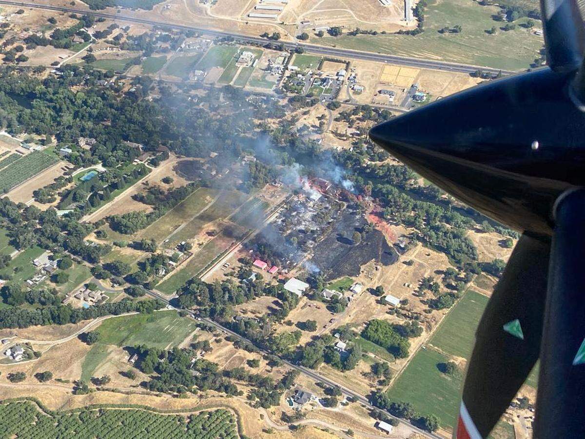 A structure and vegetation fire in the area of Orange Blossom and Lancaster roads east of Oakdale was held to under 13 acres on Saturday, July 29, 2023.