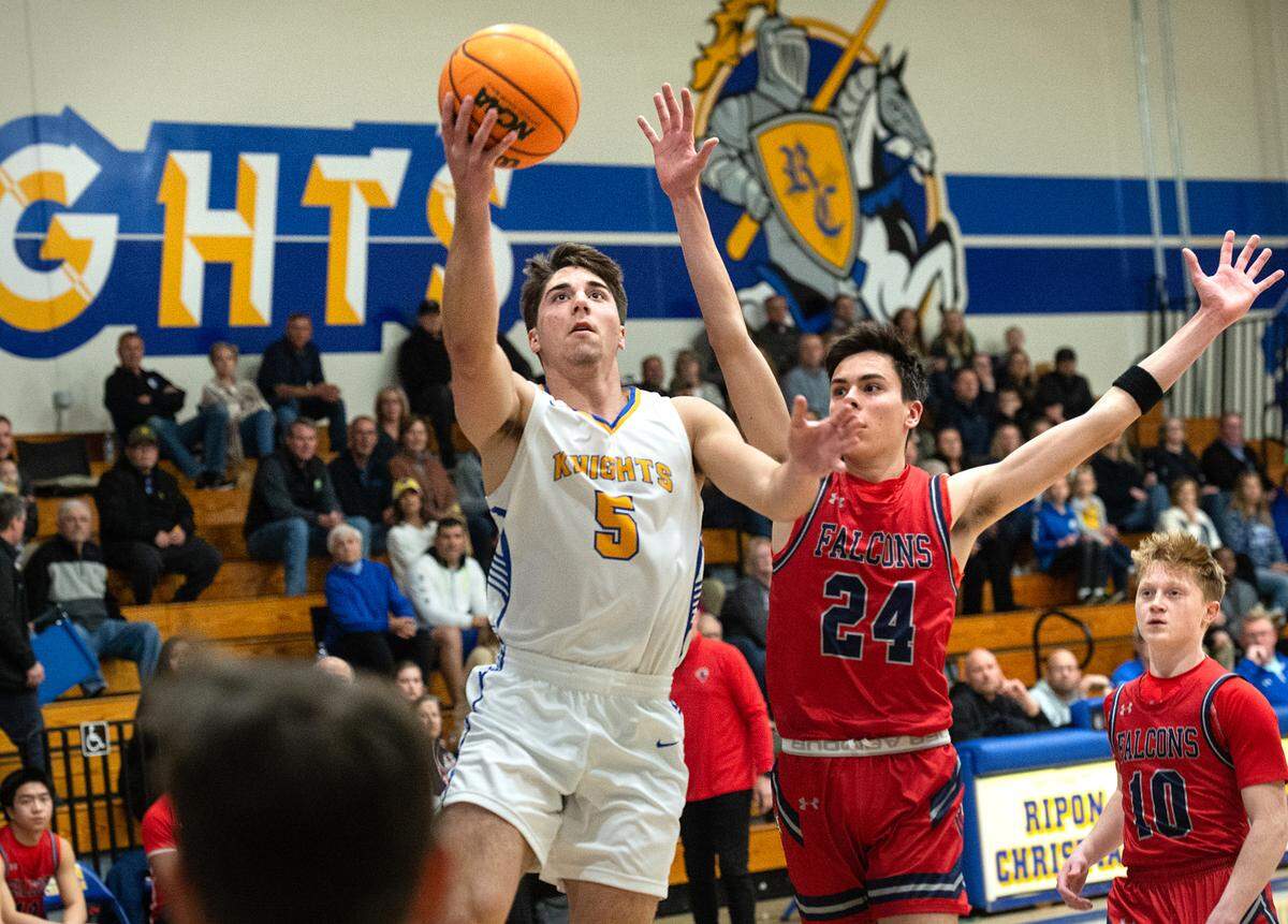 Ripon Christian’s Trey Fasani scores on a layup during the Sac-Joaquin Section Division V semifinal game with Vacaville Christian at Ripon Christian High School in Ripon, Calif., Wednesday, Feb. 22, 2023.