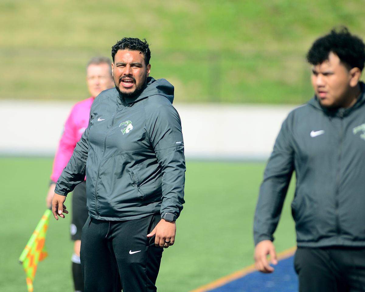 Pitman head coach Manuel Romero yells to his players during the Sac-Joaquin Section Division II championship against Woodcreek High School at Cosumnes River College in Sacramento, Calif. on Saturday, March 1, 2025.
