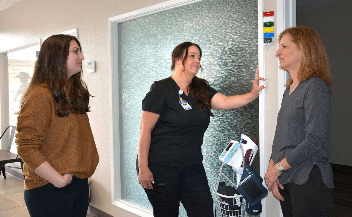 Family nurse practitioner Lisa Brush (left), office manager Wendi Jones (center) and Dr. Dena Lenser (right) inside the new Lenser & Brush Pediatric Urgent Care in Modesto, Calif. May 3, 2023.