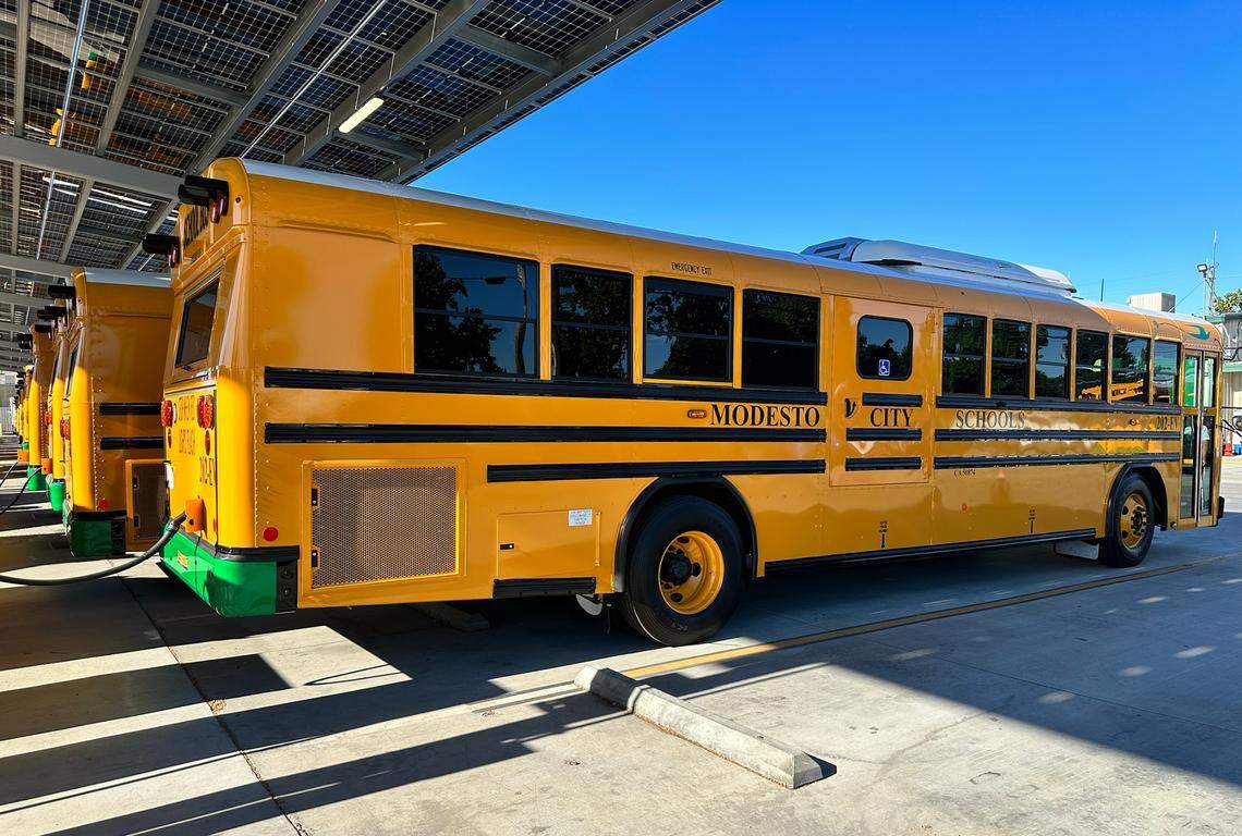 Electric buses are lined up to charge at the Modesto City Schools transporation yard on Monday, July 31. By October, over 30 buses will be charged here.