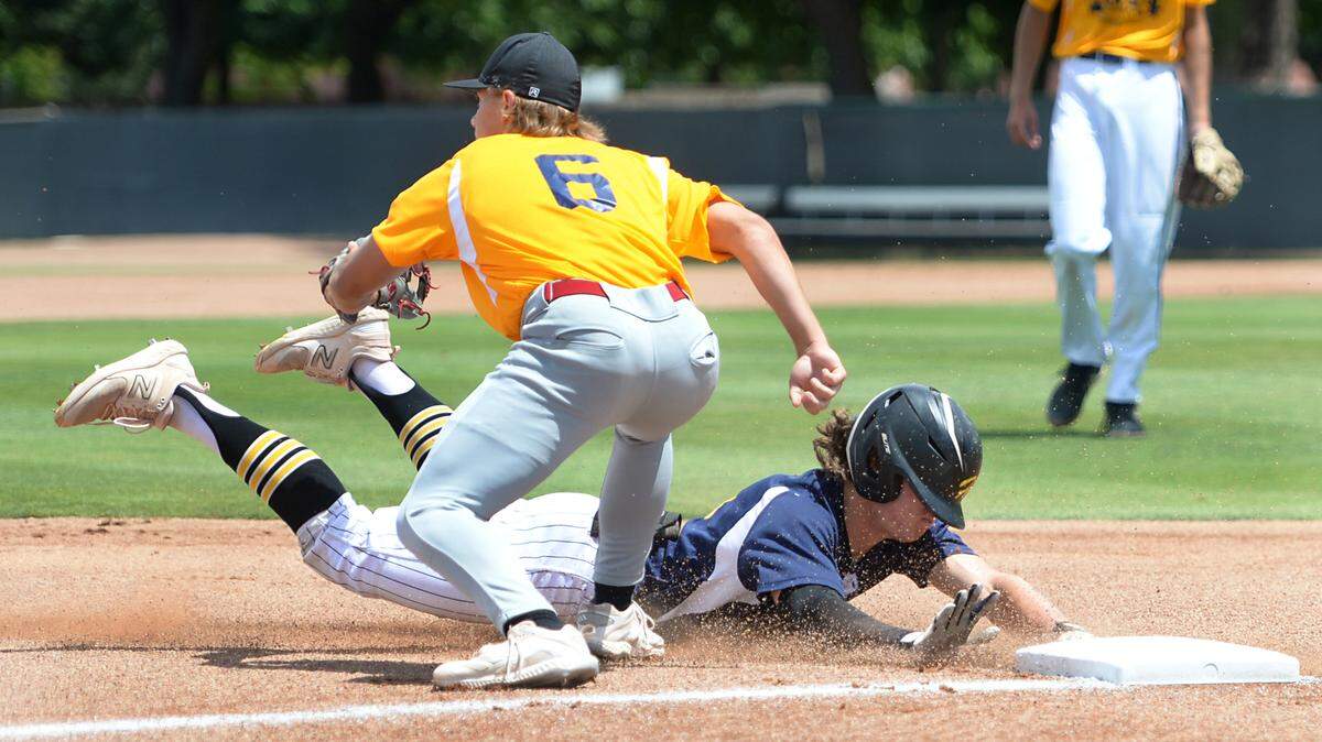 Hughson High senior Paul Wagner slides into third after hitting a triple during the 32nd Modesto Sunrise Rotary All-Star Game at CSU Stanislaus on Saturday, June 8, 2024.