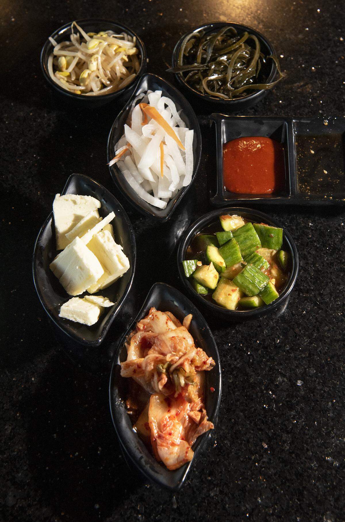 Banchan, Korean side dishes, at Hoki Korean BBQ & Japanese Cuisine on Coffee Road in Modesto, Calif., Wednesday, Oct. 23, 2019.