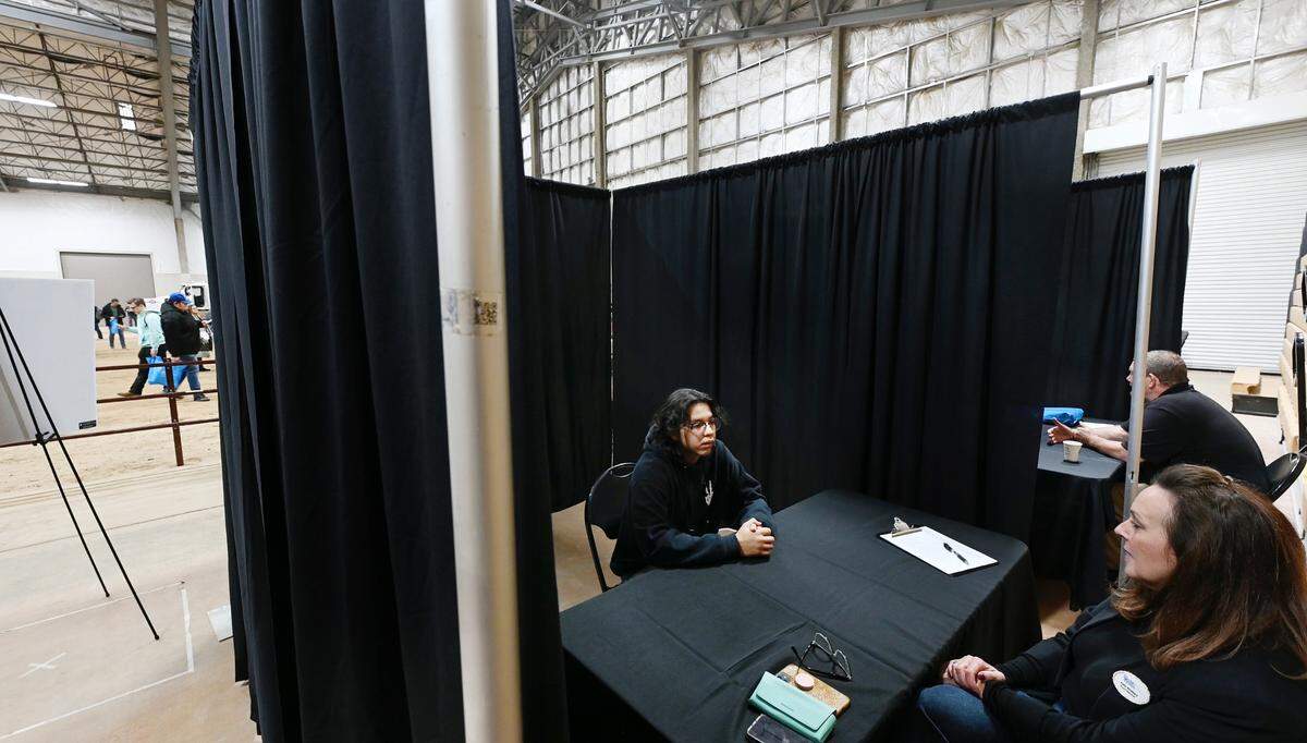 Waterford High student Adrian Castro talks with Kelly Attebery during a mock interview at Construction Trades Day at Modesto Junior College west in Modesto, Calif., Wednesday Nov. 15, 2023.