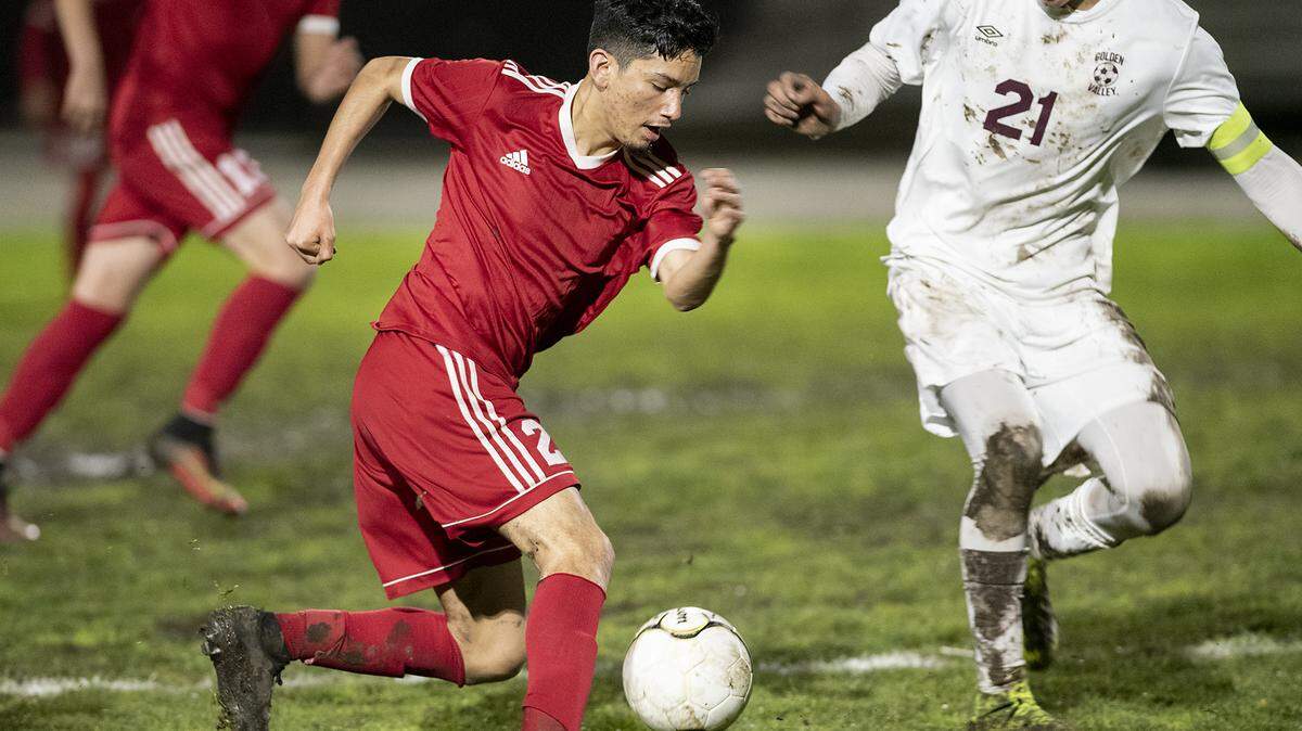 Ceres’ Andres Madriz carries the ball past Golden Valley’s Cristian Gaona during the CIF Sac-Joaquin Section Division III quarterfinal game in Ceres, Calif., Thursday, Feb. 14, 2019.