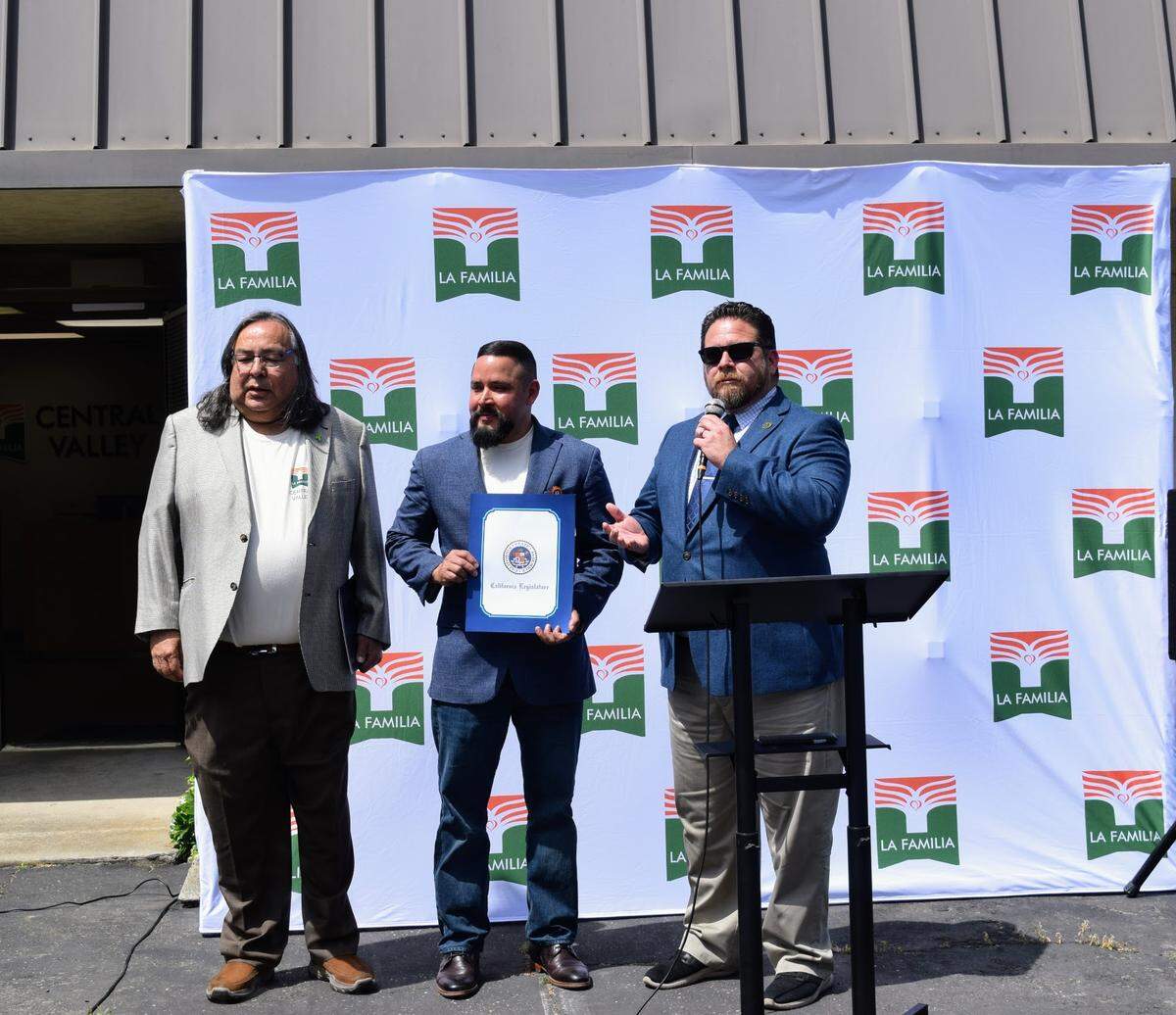 Manuel J. Jiménez Jr., Aaron Ortiz and Juan Alanis speak at the ribbon cutting event for La Familia Central Valley’s launch of the Mobile Mental Health Program in Turlock on Apr. 24, 2025.