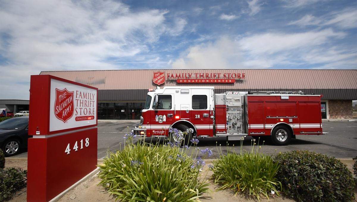 Firefighters battle a blaze at The Salvation Army Family Thrift Store and Donation Center on McHenry Avenue at Bangs Avenue in Modesto, Calif., on Thursday, June 2, 2022.