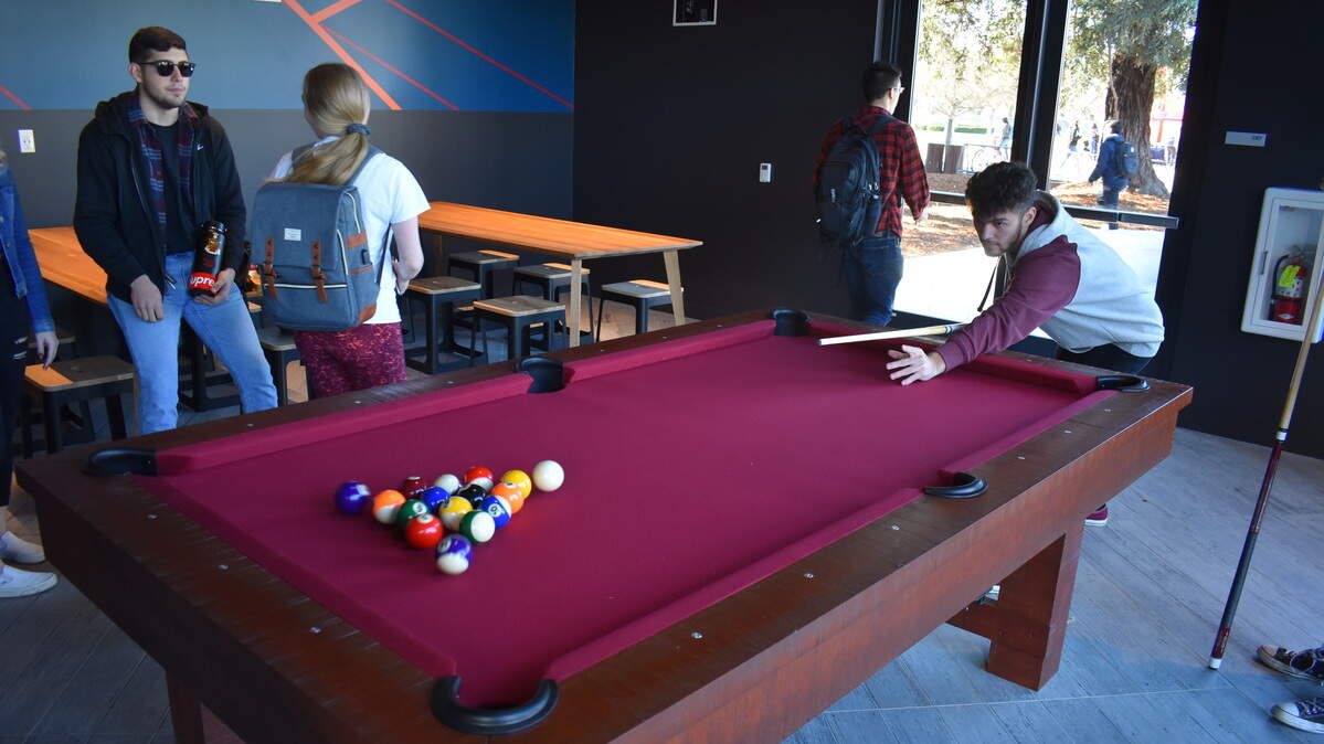 Students shoot pool in the Warrior Grill, part of the University Student Center at California State University, Stanislaus, on Monday, Jan. 27, 2020.