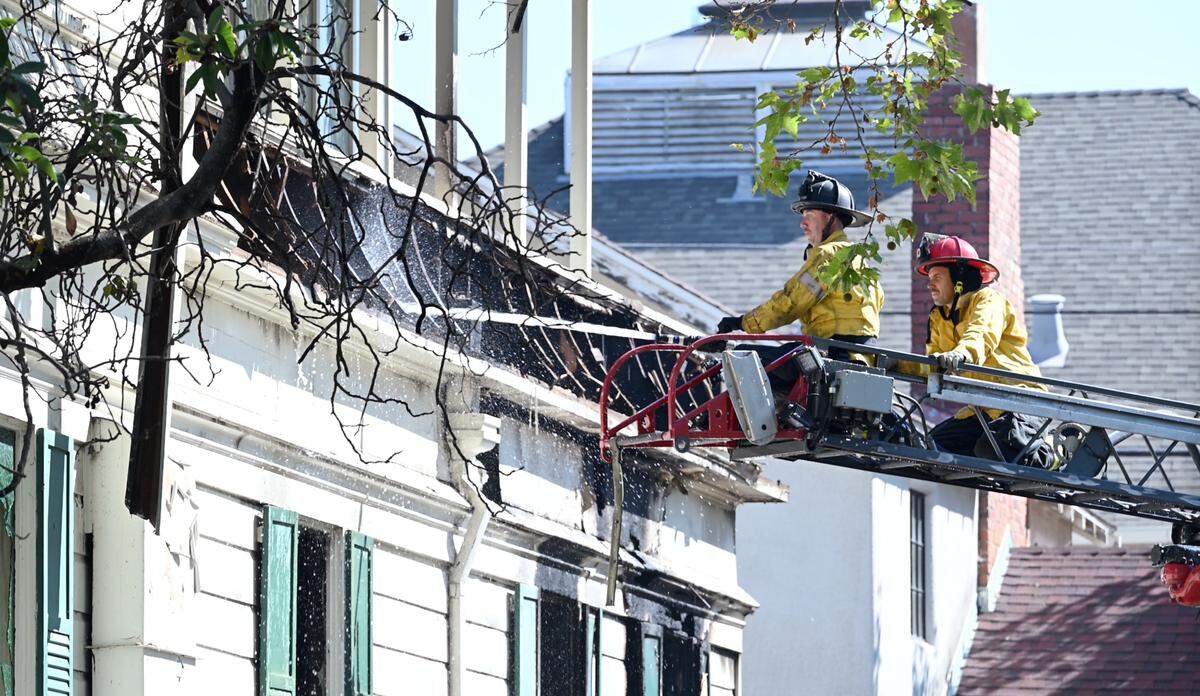 Fire crews contained a blaze at the former Franklin and Downs Funeral Homes building at 12th and G streets in Modesto, Calif., Tuesday, July 16, 2024.