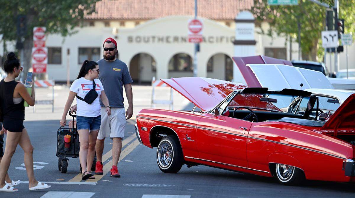 Cars from Impalas Car Club line J Street as part of the Legends of the Cruise inductees celebration at 10th Street Plaza in Modesto, Calif., Wednesday, June 5, 2024. 