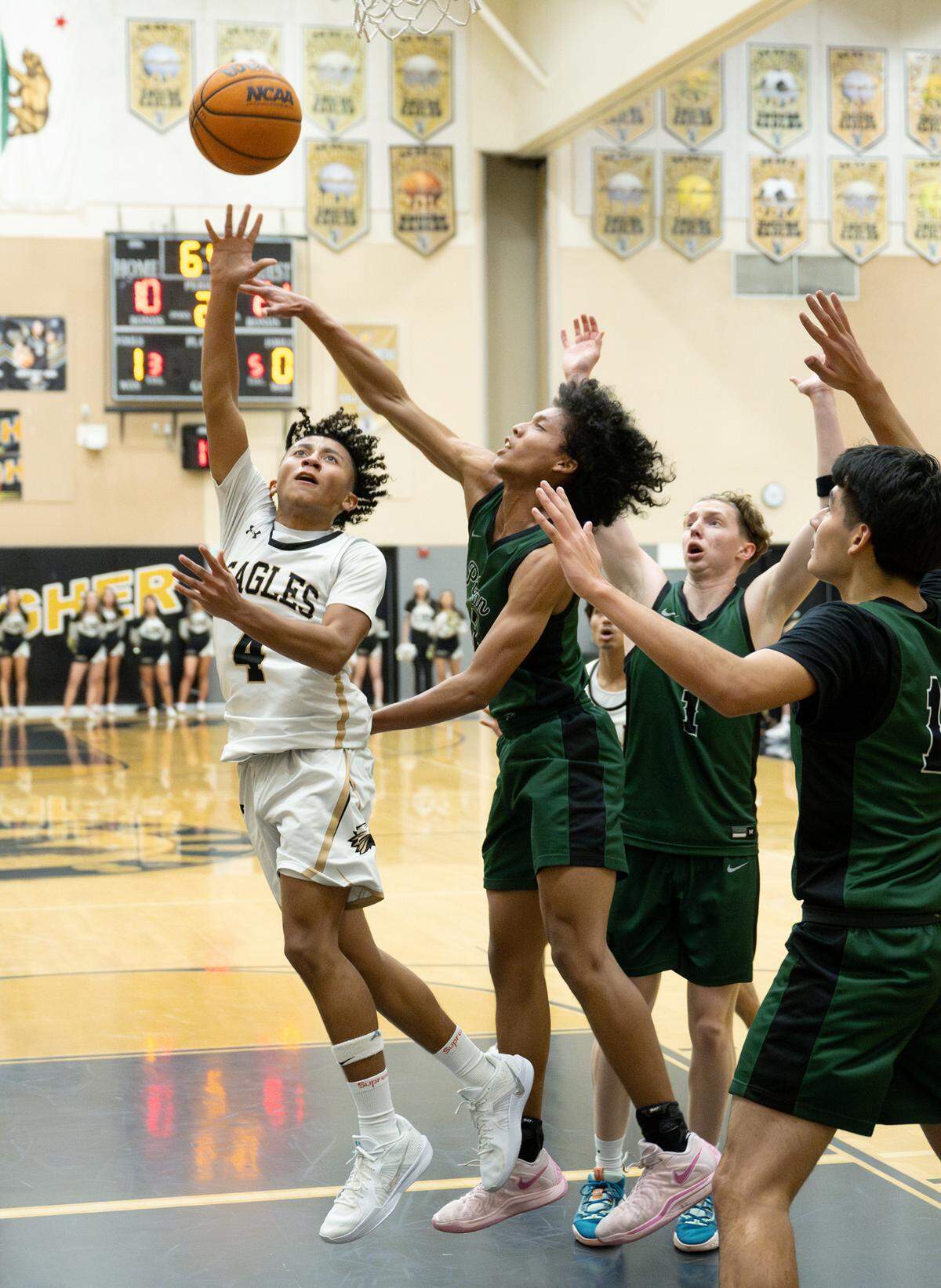 Enochs’ Mason Galvan scores past Pitman defenders during the Central California Athletic League game at Enochs High School in Modesto, Friday, Jan. 24, 2025.