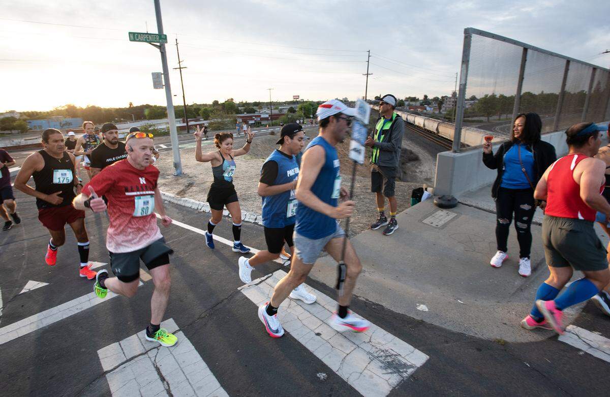 Runners turn onto Carpenter Road during the Modesto Marathon in Modesto, Calif., on Sunday, March 27, 2022.