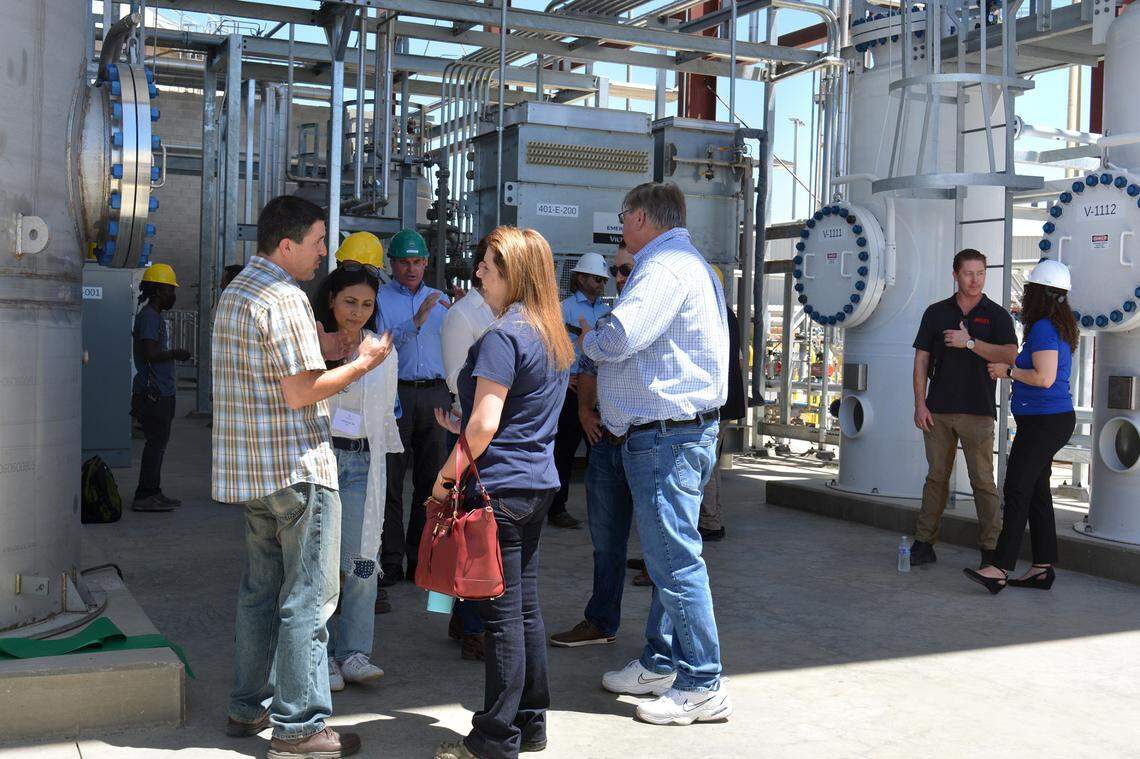 Guests mingle at the June 10, 2022, ribbon-cutting for an Aemetis plant that feeds methane from dairy manure into PG&E gas lines in Keyes CA.