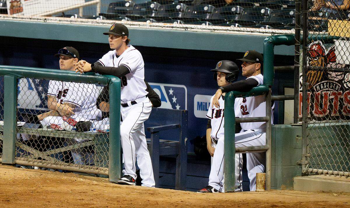 Modesto Nuts manager Zach Vincej, middle, watches the action on the field during the game with the Stockton Ports at John Thurman Field in Modesto, Calif., Friday, July 19, 2024.