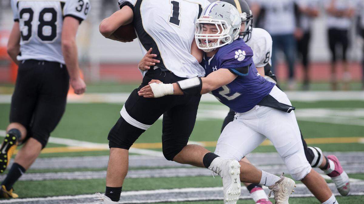Denair’s Christian Obando stops Golden State’s Robert Reed during the Sac-Joaquin Section Div. VII final victory over Golden State at Liberty Ranch High School in Galt, Calif., Saturday, Nov. 24, 2018. Denair won the game 43-21.
