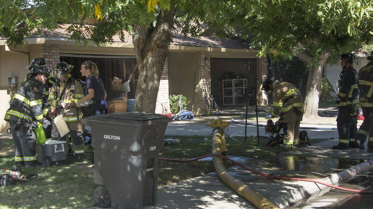 Modesto Fire crews and law enforcement are on scene of a fire at a duplex Tuesday Sept.18, 2018 on the 1600 block of Floyd Avenue in Modesto, Calif. One person was found deceased inside the home where the fire broke out. It is unclear at this time if the person died as a result of the fire. 