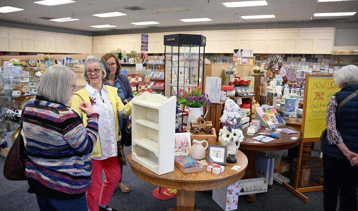 Lori Burgess, left, and Molly Flemate, second left, shop with friends Janet Harper and Jennifer Santana-Fox at Marcy’s Hallmark Shop in McHenry Village in Modesto, Thursday, March, 20, 2025. The store will be closing because the owners are retiring.
