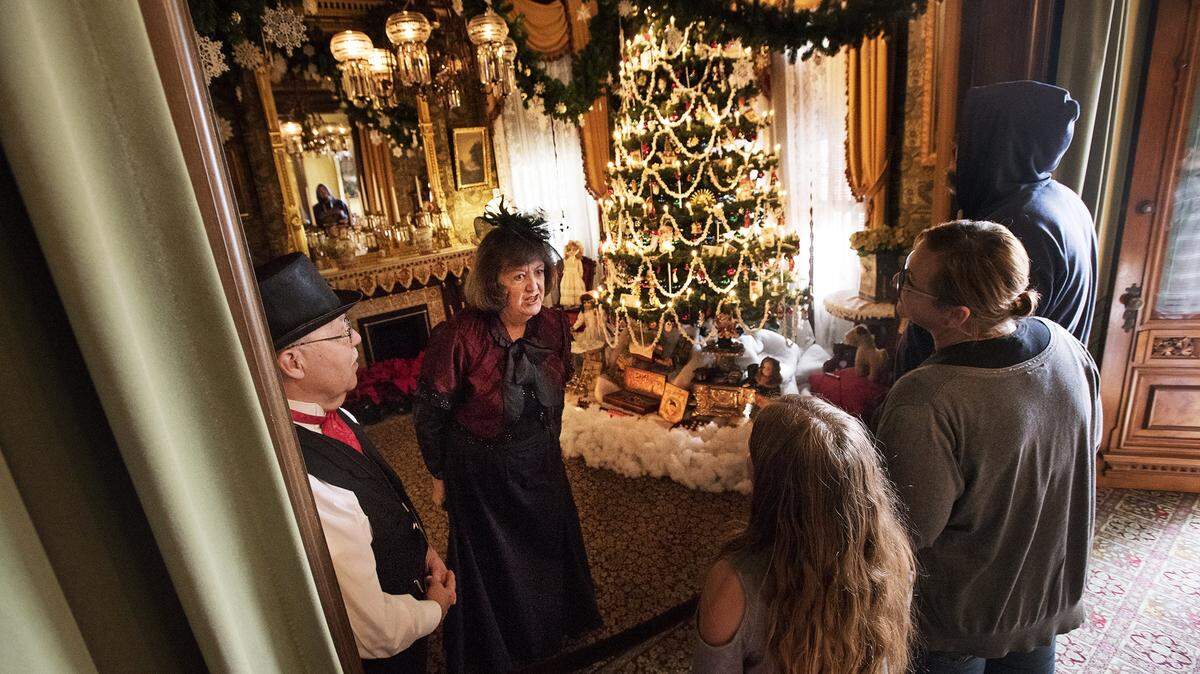 Docents greet guests arriving for the 2017 mansion tour during the Dickens Faire at the McHenry Mansion.