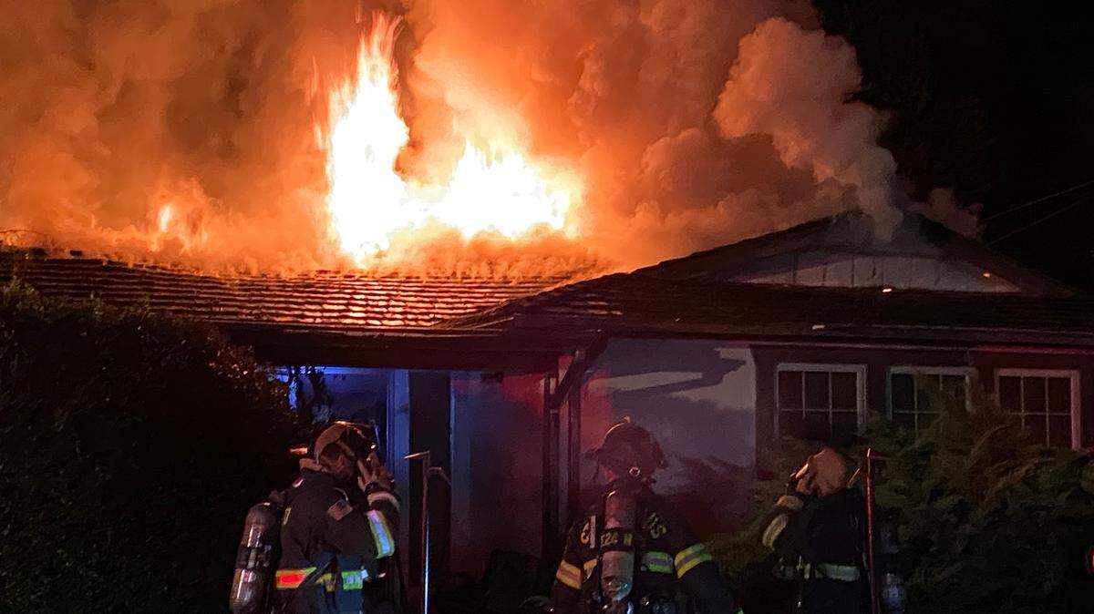 Fire destroyed the roof of a home on Stone Avenue between Oakdale and Knights Ferry on Saturday night, March 27, 2021, displacing two people.