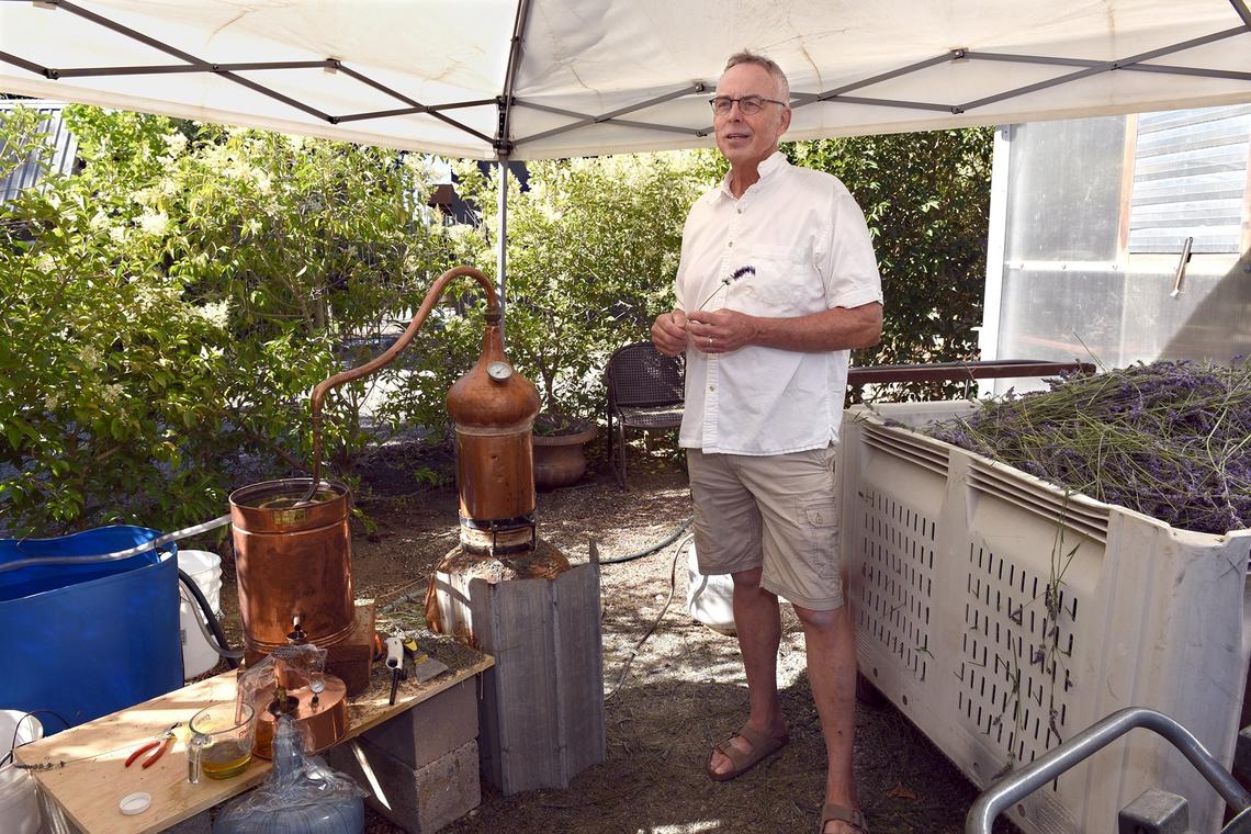 Co-owner George Kapor is pictured with his lavender distiller on Friday morning June 22, 2018 at Pageo Lavender Farm in Turlock, Calif.