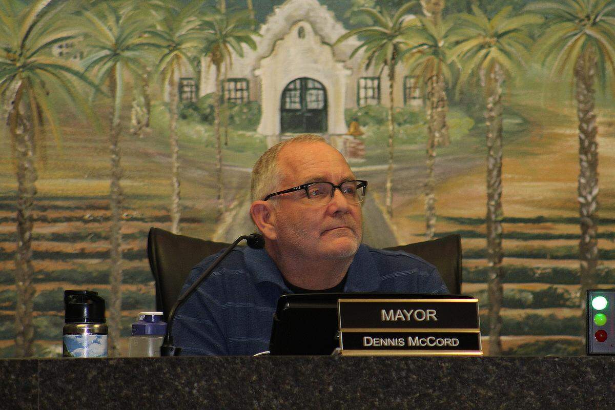 Patterson Mayor Dennis McCord on Tuesday, Dec. 7, 2021, listens to a resident urging him to resign because of his alleged inappropriate conduct with students.