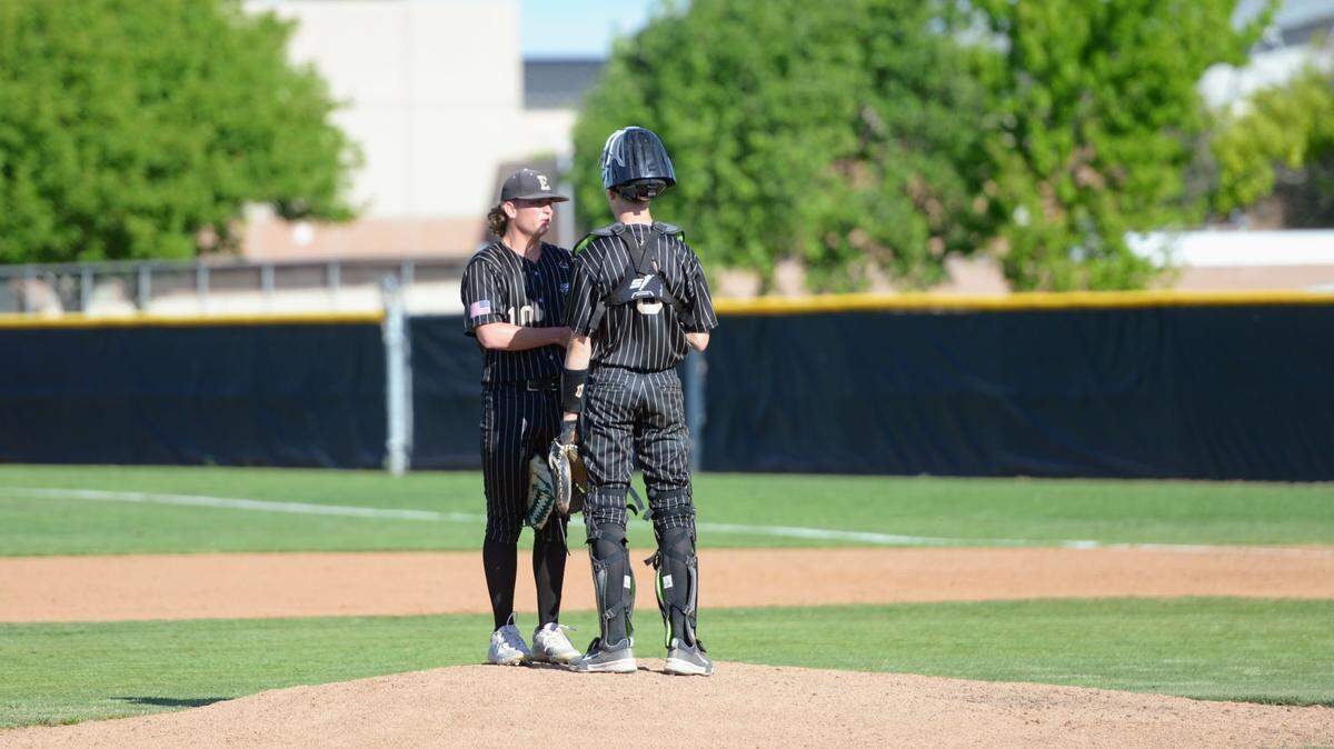 Enochs pitcher Kannon Sharpe and catcher Caden Reeve meet on the mound during a CCAL matchup with Turlock at Enochs High School in Modesto, Calif. on Friday, April 19, 2024.