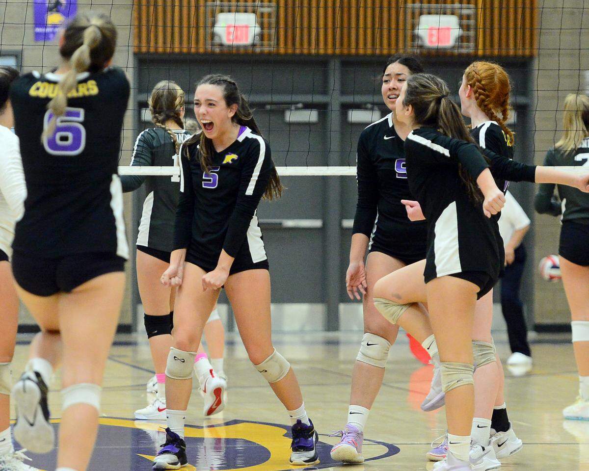 Escalon’s Emily Vickers (5) celebrates with teammates during a CIF San-Joaquin Division III Girls Volleyball Playoffs game between Escalon High School and Ponderosa High School at Escalon High School in Escalon CA on November 1, 2022. Escalon won the match 3-2.