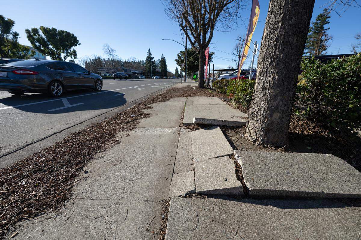 Broken sidewalk on Standiford Avenue in 2024. 
