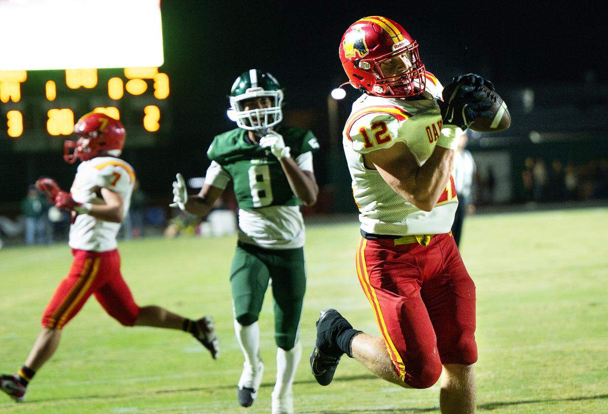 Oakdale’s Wes Burford makes a touchdown reception during the Valley Oak League game with Manteca at Manteca High School in Manteca, Friday, Nov. 1, 2024.