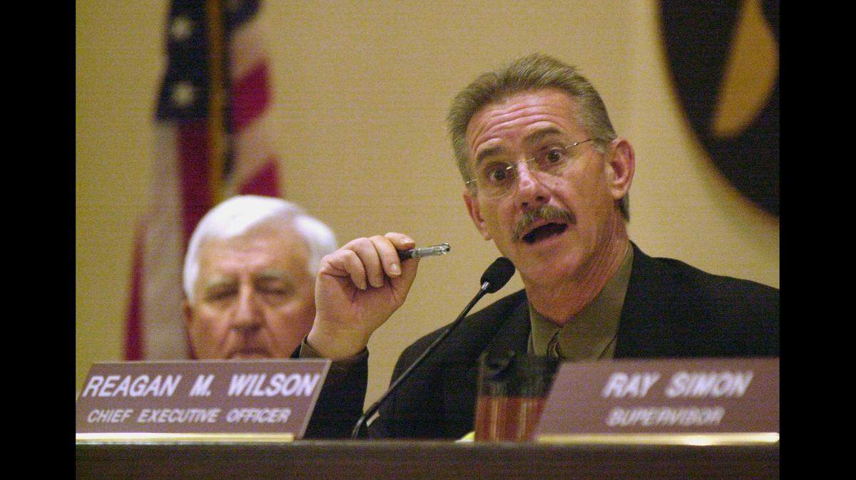 In this July 8, 2003 file photo, Stanislaus County CEO Reagan Wilson addresses his accusers during a hearing on Wilson’s recent performance questions. Wilson ultimately tendered his resignation.