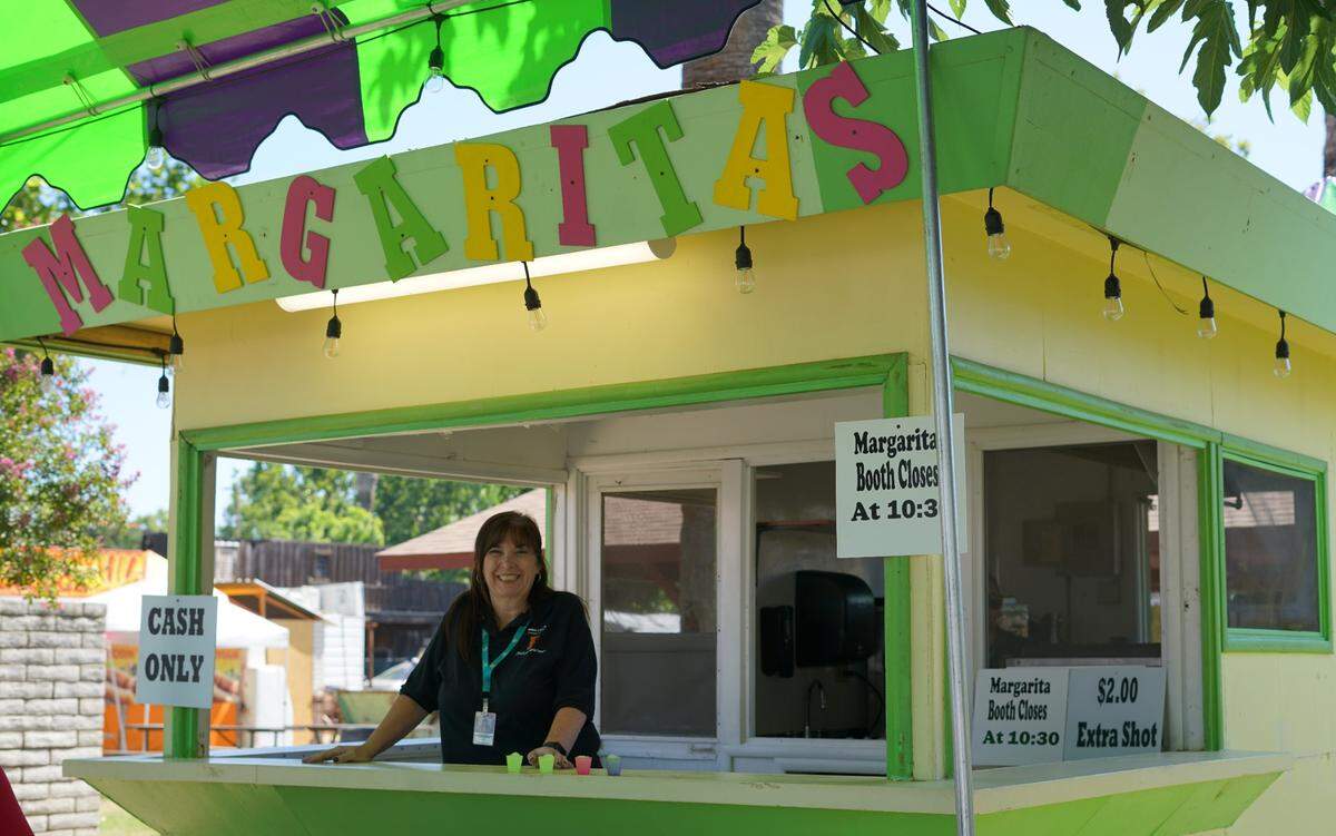 Stanislaus County Fair staff member Suzanne Dias works the margarita booth.