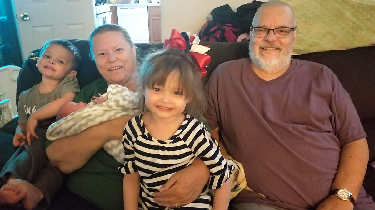 Ed and Retta Pugh of Ceres with their grandchildren before both Pughs died of COVID-19 within hours of each other, in November 2020.