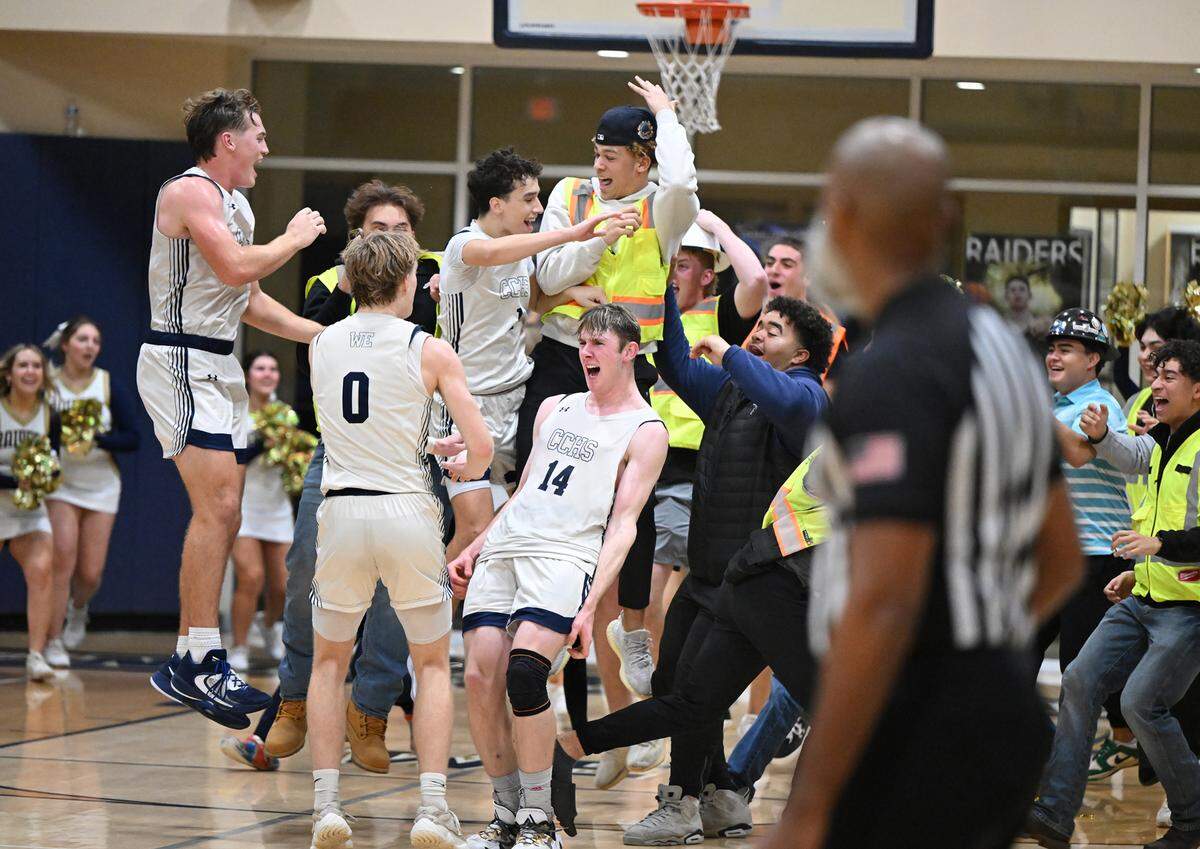 Central Catholic players and students celebrate their Valley Oak League title and win over Manteca at Central Catholic High School in Modesto, Calif., Wednesday, Feb. 7, 2024.