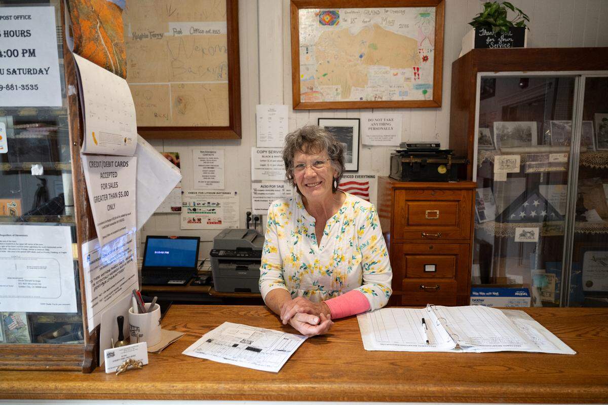 Dolly Haskell staffs the post office on Main Street in Knights Ferry, Wednesday, April 16, 2025.