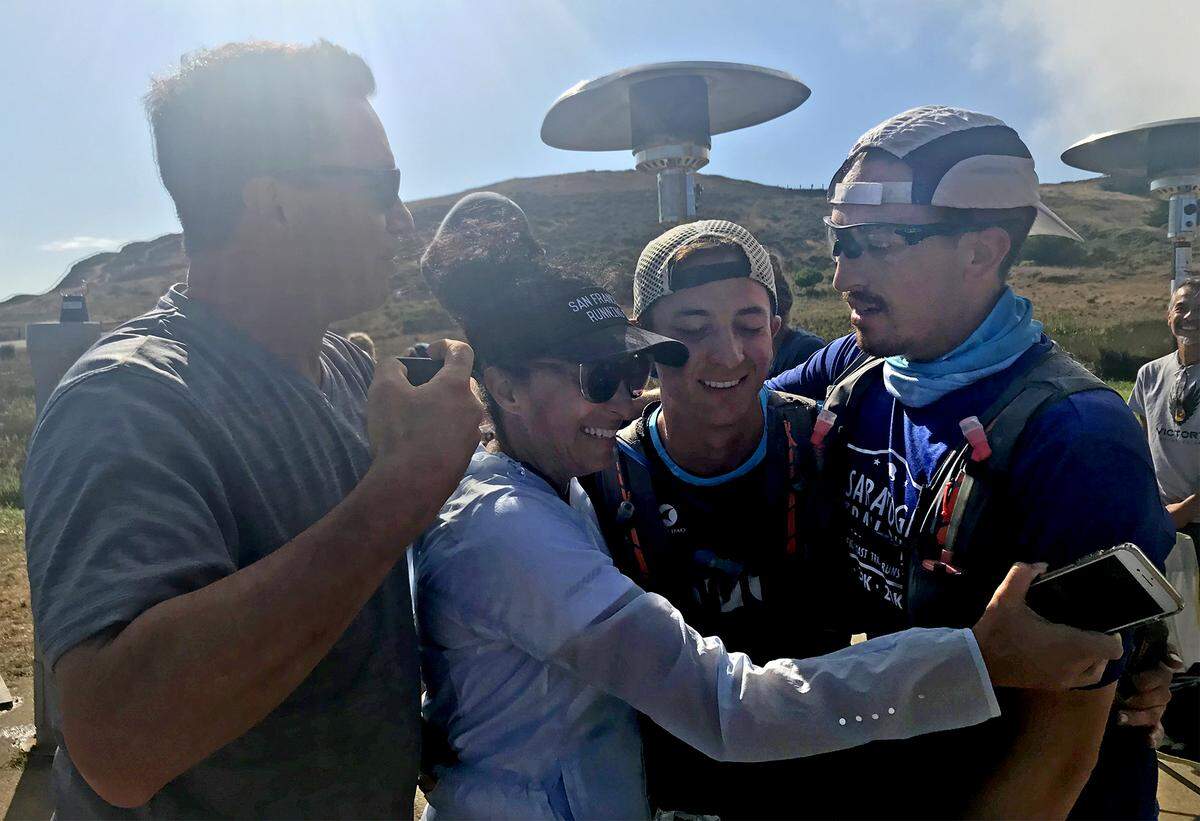 Waterford High senior Ethan Valdez embraces his family after finishing the Headlands Hundred Race at Rodeo Beach in Sausalito, Calif. on Sunday, Sept. 15, 2019. (Photo from left to right: Todd Valdez (Dad), Diana Valdez (Mom), Ethan Valdez, Ean Valdez (Brother).