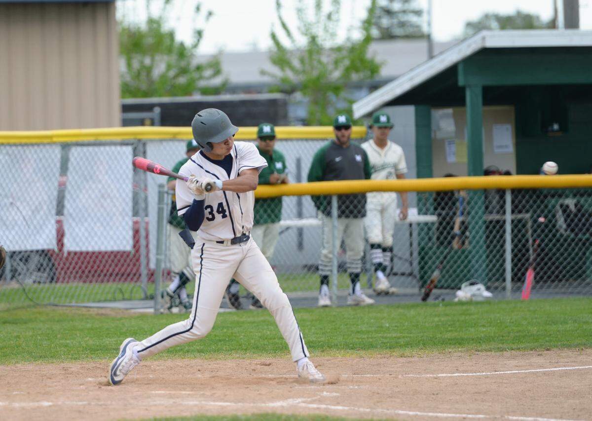 Central Catholic’s Adrian Garcia swings at a pitch during a Valley Oak League matchup with Manteca at Manteca High School on Friday, April 26, 2024.